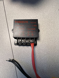 A black box with red wires

AI-generated content may be incorrect.