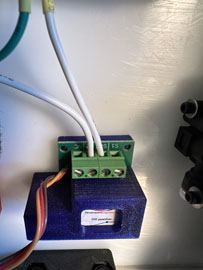 A blue box with wires attached to it

AI-generated content may be incorrect.