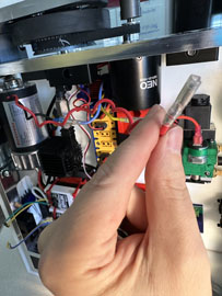 A hand holding a red cable

AI-generated content may be incorrect.