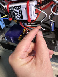 A hand holding a small device

AI-generated content may be incorrect.