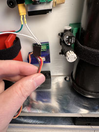 A hand holding a wire

AI-generated content may be incorrect.
