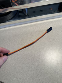 A hand holding a wire

AI-generated content may be incorrect.