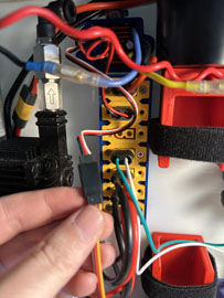 A hand holding a wire

AI-generated content may be incorrect.