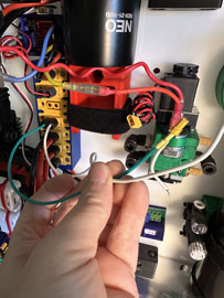 A hand holding a wire

AI-generated content may be incorrect.