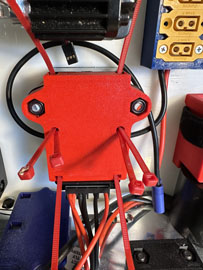 A red box with wires and wires

AI-generated content may be incorrect.